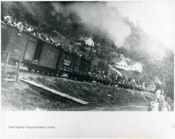 'Photo by Sara Jane Pollock, daughter of A.W. Pollock, gen. Manager of Spruce River Coal Co., whose house is the highest one in this picture.'