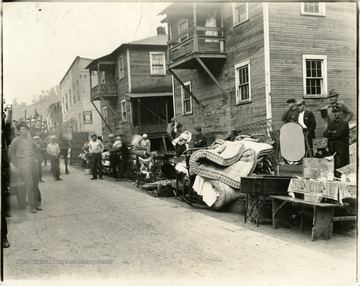 'Foreground 2 of 3 buildings are still standing. White building is store owned by Pete, brother to Emmanuel (Mike) Viola (L. Birurakis, 1992/12/21). Mike Viola's garage is on the road on the left.'