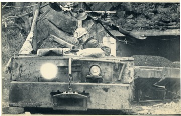 'Coal Miner, Herbert Presley, drives a tandem motor out of the Flat Gap mine near Norton Virginia, Thursday. Presley is on the last shift to work prior to the strike set for 12:01 Friday morning. (AP Laserphoto) (sh51850stf-sh)81 SLUG VIRGINIA MINES.'