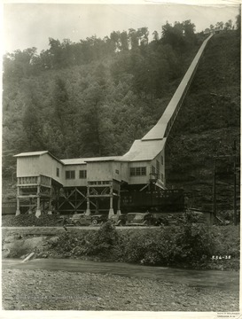 Coal tipple at Red Parrot.  Large chute coming from the coal mine. Chesapeake and Ohio Railroad car being filled.