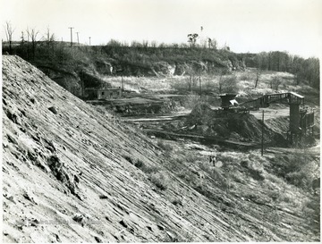 Hillside with wooden tipple in the background.