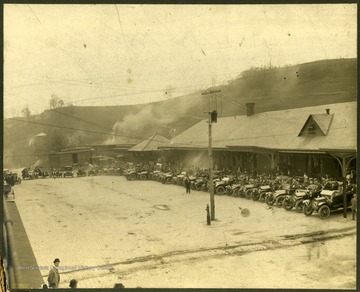 Cars and drivers are lined up in front of the B&amp;O depot, in Clarksburg, West Virginia.