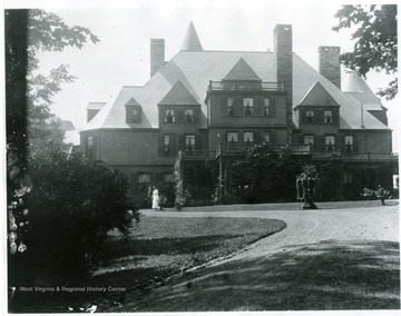 Two women walk outside of Halliehurst.