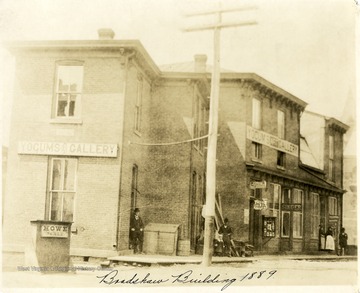 Men stand around the Yocum's Art Gallery in the Bradshaw Building in Grafton, W. Va.