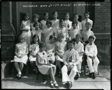 Members of the Harmonica Band, 6th and 7th Grades, of South Grafton School in Grafton, West Virginia pose for a group portrait.