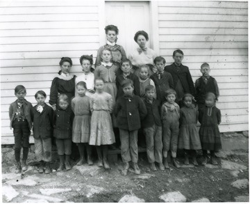 Back Row:  Rose Betler Haslebacher, Lena Haslebacher; Middle Row:  Hulda Dubach, unknown, Minnie Betler Malcomb, Arnold Betler, Alma Betler Burky, Erwin Burky, Werner Burky, unknown; Front Row:  George Betler?, unknown, unknown, Anna Karlen, Clara Karlen, George Schlueniger, Norman Betler, unknown, Bertha Stadler, unknown.