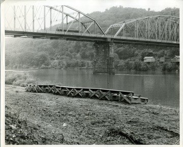 Westover Bridge visible beyond platform set up for concert.