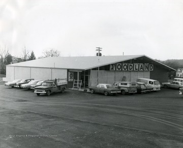 Foodland Grocery Store located in Morgantown, W. Va. Vehicles parked outside of store in parking lot. 