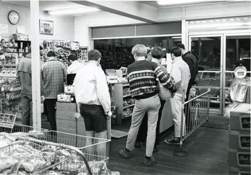 Sunnyside Superette convenience store located on University Avenue in Morgantown, W. Va. Shoppers waiting to check out with products. 