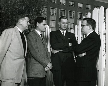 Ministers include: 'Reverend John Doane (third from left), Revered Benjamin James, Reverend Stacy Groscup'.  