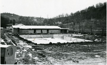 Men work on pool construction between Morgantown and Sabraton.