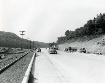 Workers constructing a four-lane highway south of Morgantown, W. Va. 