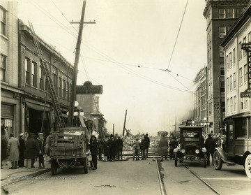 Debris left from the Strand Theatre fire on High Street in Morgantown, W. Va. Crowd gathered to see the sight. 