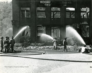 Firefighters working to extinguish fire at the Moore Electric Building in Sabraton, near Morgantown, W. Va. 