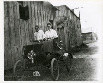 Harry Selby and an unidentified woman are riding in car in Morgantown, West Virginia.