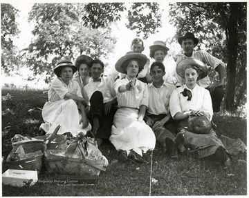 'Harry and Paul Selby are the two seated men.' The woman in the middle is  pointing a pistol.