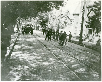 People walking down Spruce Street.