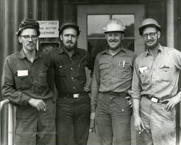 Unidentified workers pose for a group photo.