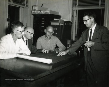 From Left to Right: 'J. D. Ward, Milton Cohen, and Robert Nestor', on far right: Unknown. 