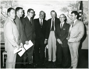 'From left to right: Don Weiner, Tom Miller, unknown, Laurence Snyder, unknown, Vernon James, unknown.'