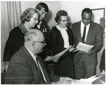 Sitting in the front left is Wilbur V. Bauer, City Art Director.  Directly behind him is Dr. Barbara Drainer.