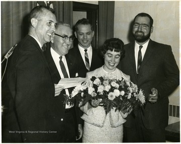 The two middle men from left to right are: Bush Swisher and Burkey Lilley.