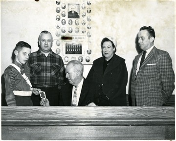 From left to right the people are:  Taylor boy, Fred Elig, Cliff Haugh, Pauline Trickett and Ken Maderia.