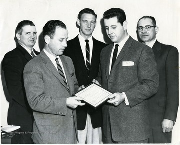 In the front row on the right is Harry Howell.