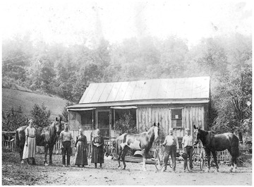 'L to R:  Alice Jane Moore (1890-1955), Charles Richard Moore (1902-1937), Arsula Katherine (Cole) Lawlis (1844-1936), Nancy Cordelia (Lawlis) Moore (1867-1938), Richard Galusha Moore (1864-1928), Theodore M. Moore (1906-1944).  This photograph was taken at the end of the era of farming with horses.  The horses are prominent in the family group as they were in the farm livelihood.'