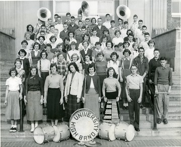 Group portrait of band members with their instruments.