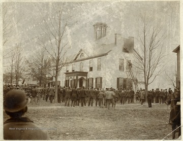 People watch as the Monongalia Academy in Morgantown, West Virginia burns.