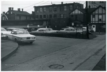 Cars are parked on Moreland Street in Morgantown, West Virginia. Moreland Street is currently at the site of Spruce and Pleasant Street Parking Lot.