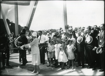 Crowd gathered for a ribbon cutting ceremony in Morgantown, West Virginia.