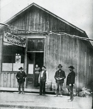 A view of Dougherty's 'Eagle Saloon'in Weston, located on the East side of Main Street between 1st Street and Bank Alley.