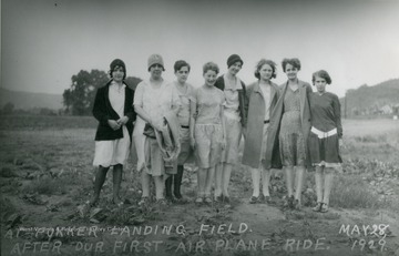 A group portrait of the girls at the Fokker landing field after their first airplane ride.