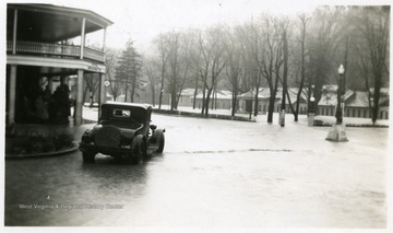 Car parked along a flooded street in Berkeley Springs, W. Va.