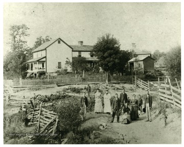 'Sometime before 1900.' Pictured left to right:  E.J. Miller, Sadie Miller, Mrs. John Miller, Prof. John Miller, Jacob Clem Miller, Mrs. William C. Miller, Low Coffman (boy), William C. Miller, Mother of W.C. Miller (seated), man in back is unknown.  Photo was Loaned to Collection by Mrs. Paul Conrad,daughter of William C. Miller.