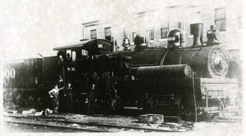 Men stand beside the Shay engine. (From postcard collection legacy system.)