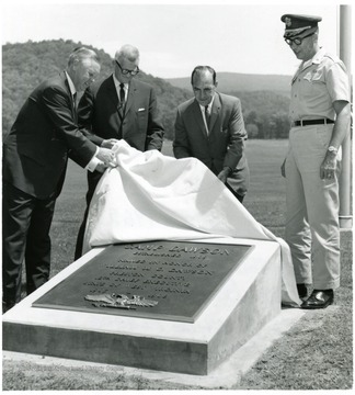 Plaque reads ' Camp Dawson established in 1901.  Named in honor of William M. O. Dawson.  Preston County 12th Chief Executive State of West Virginia 1905-1908'