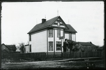 View of the Walls hotel with two women and one man out front.