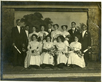 A group portrait of graduates of Old Kingwood Academy. Sixth from left is Isa Davis, mother of Dr. D. R. Davis, Kingwood.