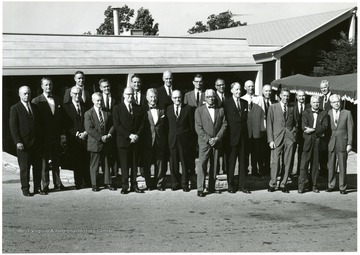 Directors and Officers of the Allegheny Power System toured the Monongahela Power Company service area Sept. 21-23.  Pictured at Lakeview Country Club they are left to right; Harold F. Butler (director), Charles B. Finch (ABS vice president), G. B. Hoffman (EHV project director), Norman Laughlin (public relations director--Monongahela), Hugh D. McDowell (APS vice president and secretary), E. Wallace Wilkinson (APS vice president and treasurer), Donald M. Kammert (Monongahela president), Francis H. May Jr. (director), George F. Schurman (director),  Robert J. MacDonald (West Penn Power Executive vice president), Benjamin Bennett (West Penn Power secretary and treasurer), Edward H. Walworth Jr. (director), J. Lee Rice Jr. (APS president), Charles D. Lyons (Potomac Edison President), Earle S. Thompson (chairman of the board), William A. Lyon (director), Harold Fetty (Monongahela representative), J. M. McCardell (Potomac Edison vice president), Joseph H. Taggart (director), Walter McKinney  (Monongahela representative), Allen Kenyon (APS controller)and James Wilt (Morgantown Division Manager). 