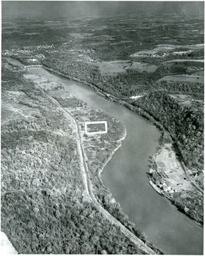 "The rectangle in the center of the picture above marks the location of Fort Martin Power Station, the first unit of which is scheduled for completion in 1967.  The unit will cost $57.5 million, will have a generating capability of 500,000 kilowatts and will burn about 1,350,000 tons of coal per year, all of which will come from mines in the immediate area.  The plant will be about three-quarters of a mile upstream from the Pennsylvania state line."