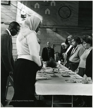 Opening and closing prayers were offered by the Rev. Richard Sellers, left at the 26th annual dinner in Pursglove.