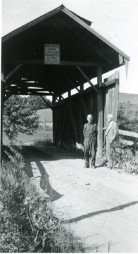 Sign reads: 'Gross weight over 6000 pounds prohibited by order the State Road Commissioner