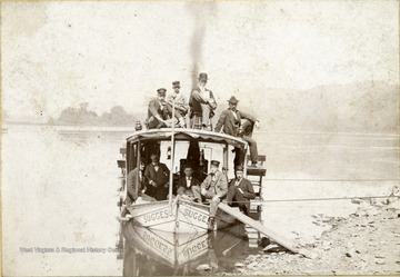 "Geo M. Crawford, father of S. C. seated on right."