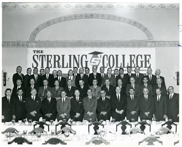 Group Portrait of employees at a banquet.