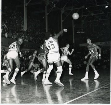 Players in the photo include Carrey Bailey, 52, Jim Lewis, 33, and Greg Ludwig.