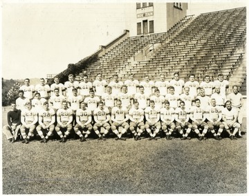 'Left to right First Row:  Manager Dave Johnson, John Carliss, Charley Seabright, Bill Jennings, Jess Richardson, Harry Clark, Dick Dolly, Joe Butta, Charley Hockenberry, Sam Pinion, Bob Mellace, Mike Gussie, Albert Baisi and Line Coach Jules Carlson.  Middle row:  Backfield Assistant Sam Audia, Frank DeFranco, Danny Shearer, Joe Czajka, Pete Antolini, John Shonk, George Sharp, Bob White, Don McCann, Glennis Ellis, Dick Welch, Scout Ira Rodgers, Trainer Art Smith, and Coach Dr. Marshall Glenn.  Back row:  Henry Sterle, Tom Davies, John Rockis, Tom Gillooly, Bud Smith, Doug Phillips, Ed Ossoski, Sam Mandich, Tony Rapaswick, Walter Pike, Henry Goodman, Bob Keckert, Charley Stansbury, and Joe Cestaric.'