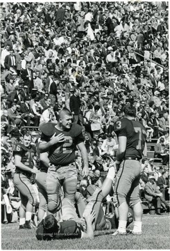 Don Vail (76) looks on as Herb Lauver, Gene Ciccarelli (73) aid Pat Buratti. 